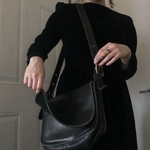 Black leather coach messenger bag